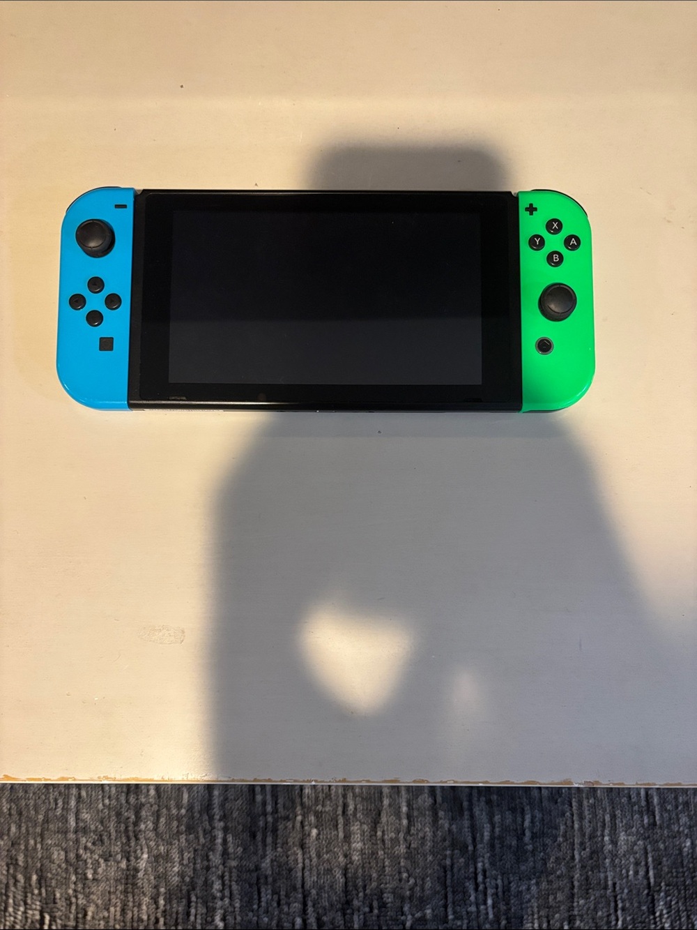 Nintendo Switch with Neon Blue Left and Neon Green Right Joy-Con
